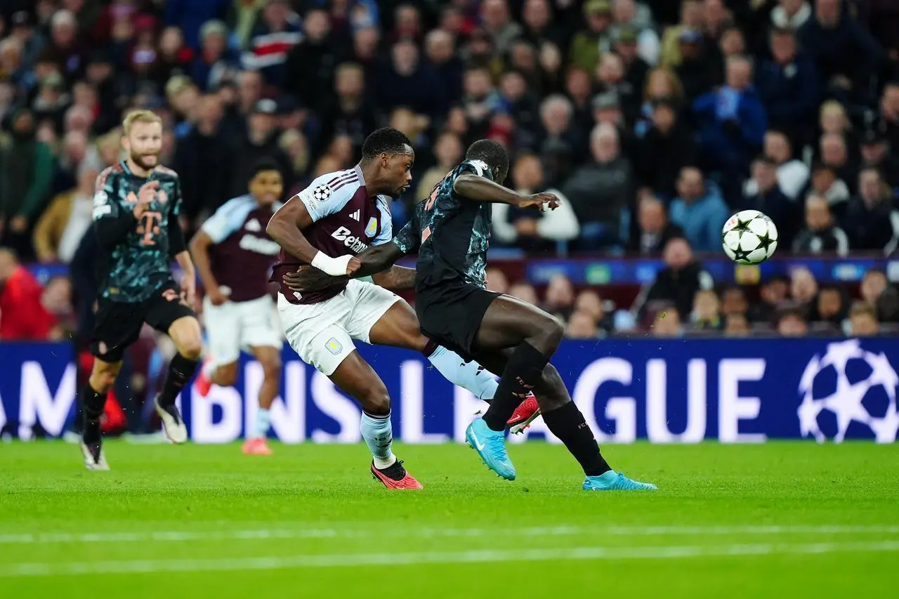 Jhon Duran scores Aston Villa’s winning goal under pressure from Bayern Munich's Dayot Upamecano, right