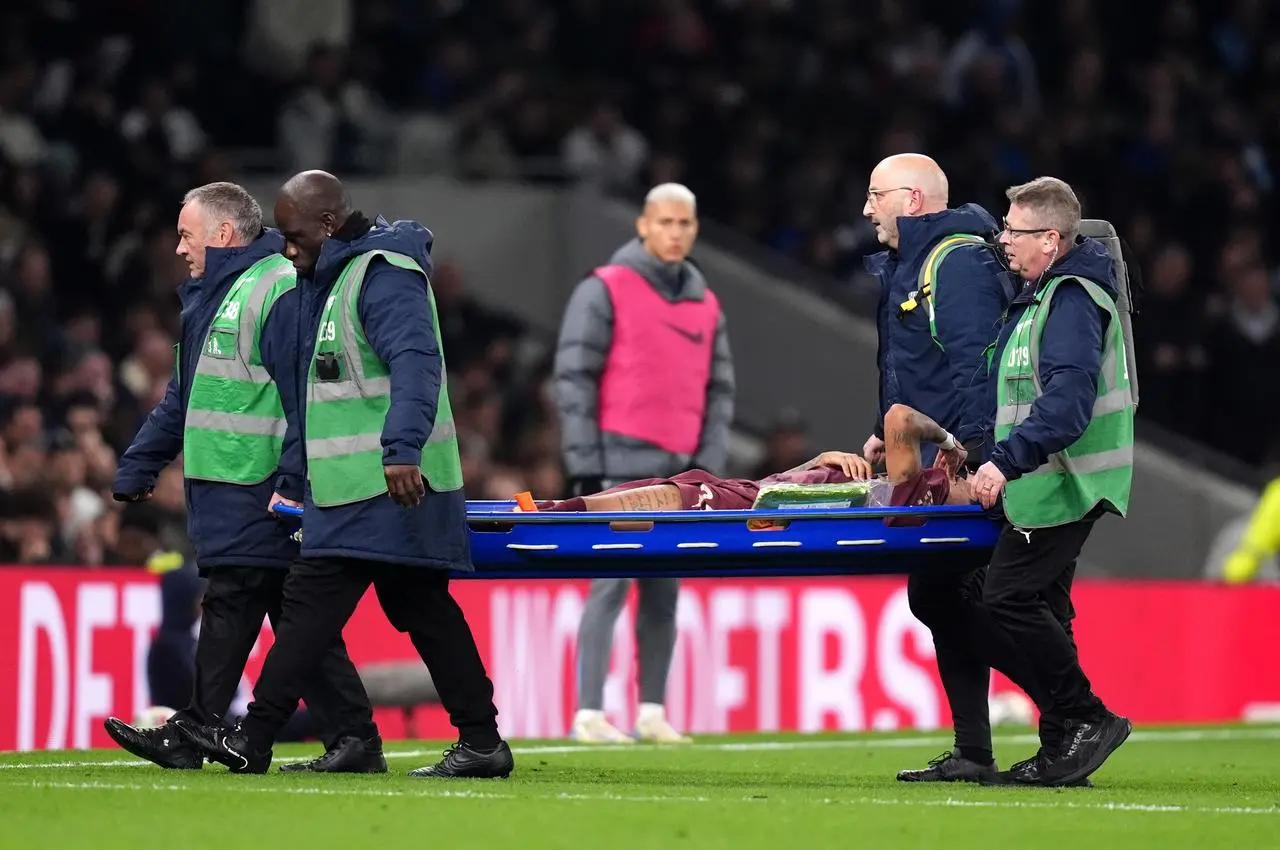 Manchester City winger Savinho is taken off on a stretcher