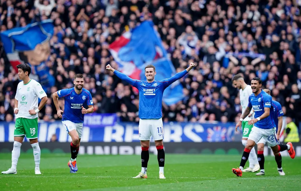 Tom Lawrence celebrates scoring Rangers' opener against Hibernian at Ibrox (