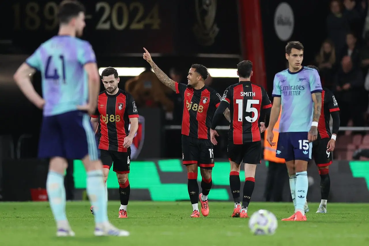 Justin Kluivert, centre, points towards the stand after scoring Bournemouth's second goal against Arsenal