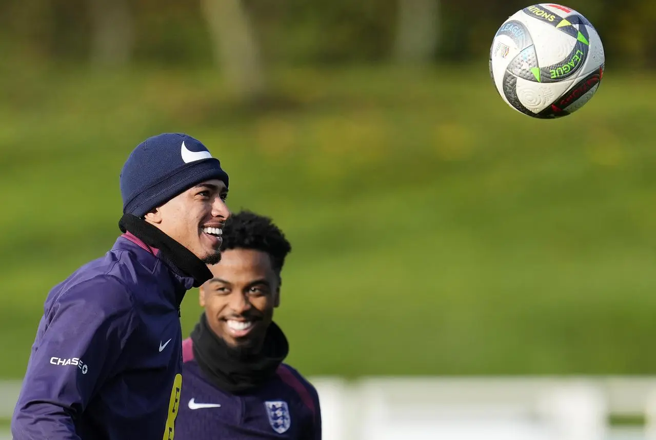 England’s Jude Bellingham watches a ball in the air at England training