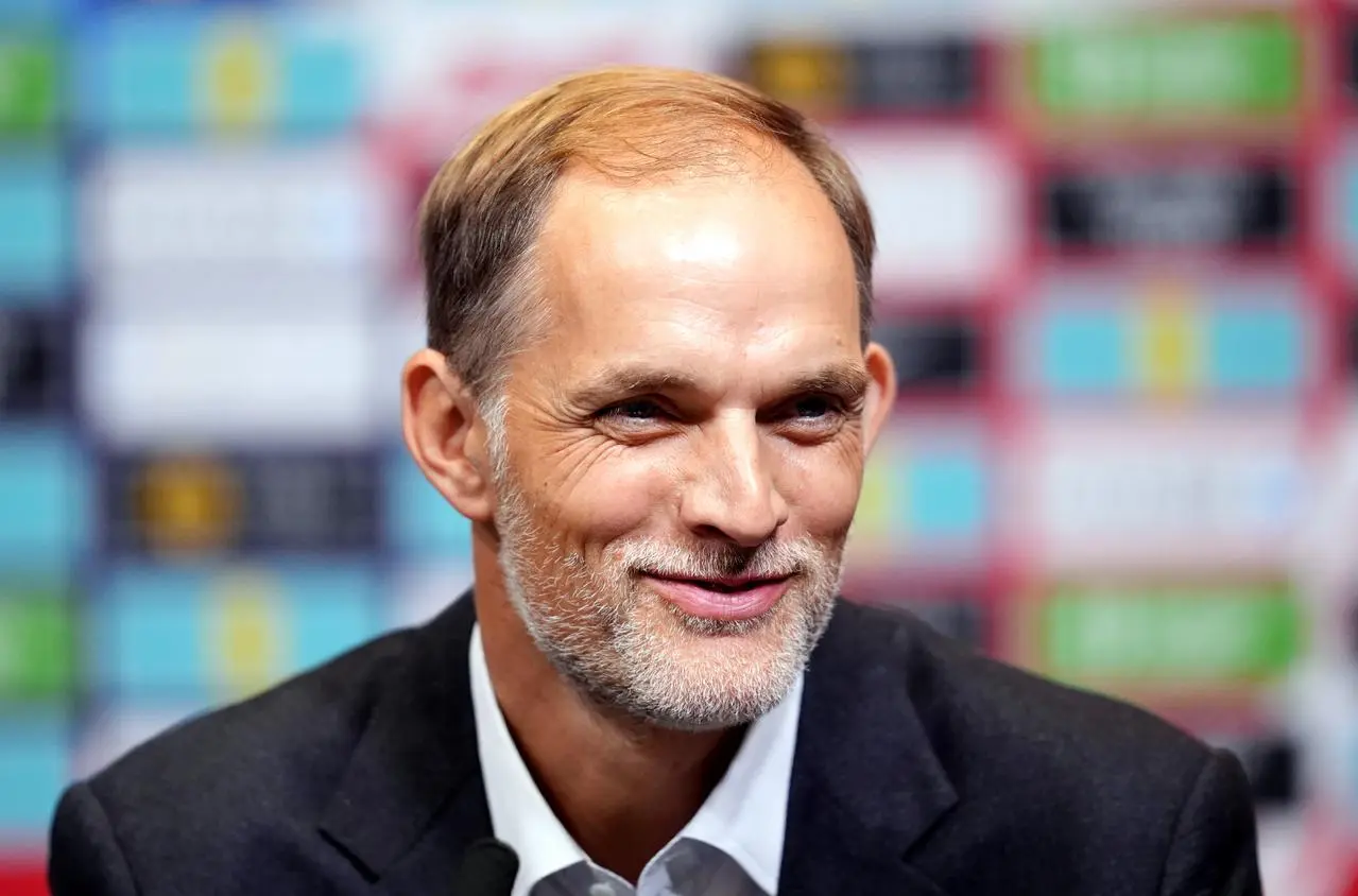 Thomas Tuchel smiles during an England press conference 