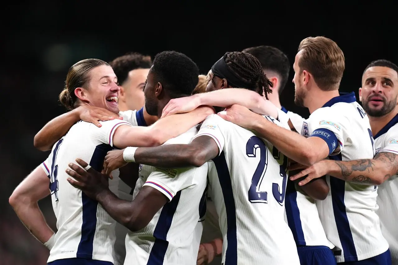 England celebrate in a huddle at Wembley