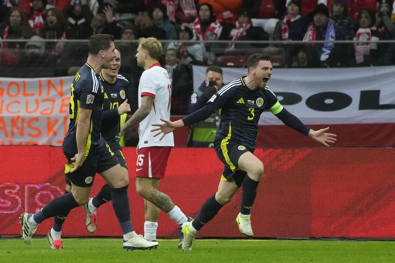 Scotland’s Andy Robertson (right) celebrates with his team-mates