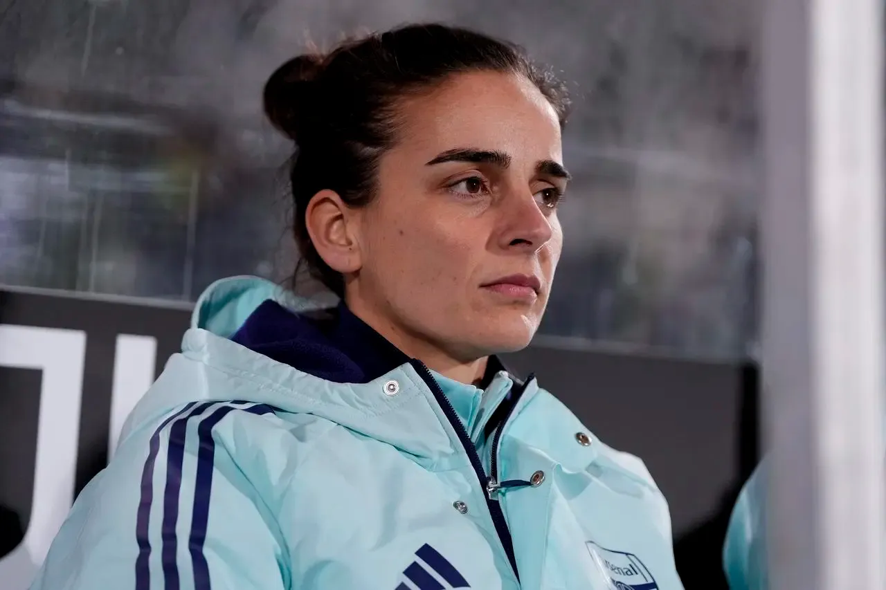 Interim Arsenal head coach Renee Slegers sits in the dugout