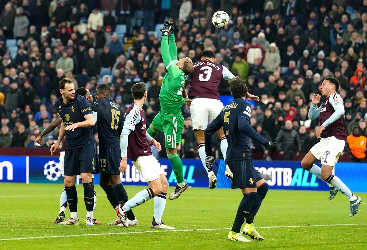 Diego Carlos battles for the ball with Juventus goalkeeper Michele Di Gregorio before Aston Villa’s first goal is ruled out