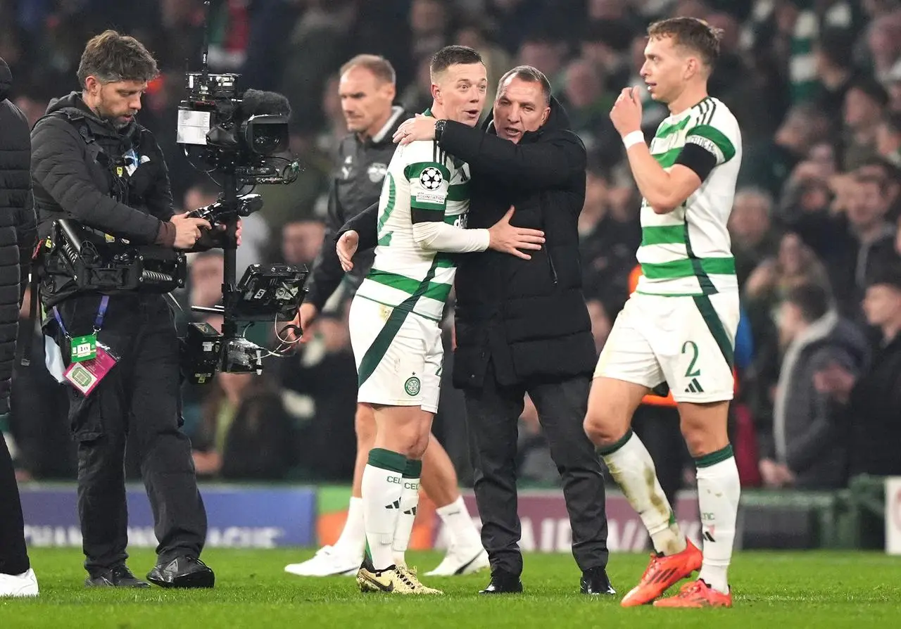 Celtic manager Brendan Rodgers, centre right, and Callum McGregor celebrate victory over Leipzig