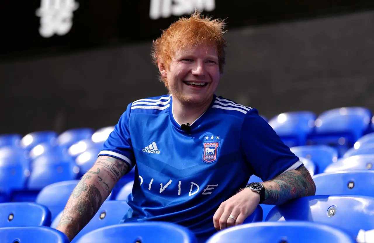 Ed Sheeran sat in the stands