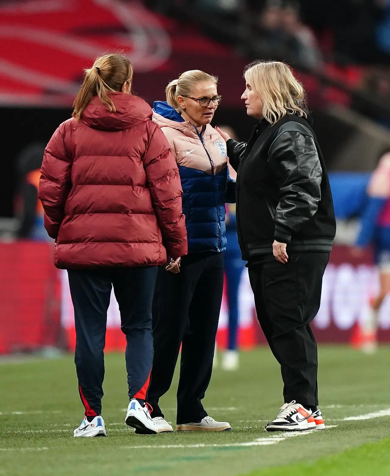 England manager Sarina Wiegman and USA manager Emma Hayes speak on the touchline before their friendly