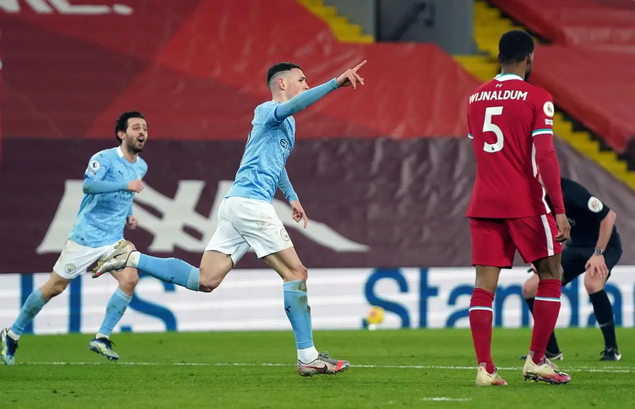 Phil Foden celebrates scoring against Liverpool