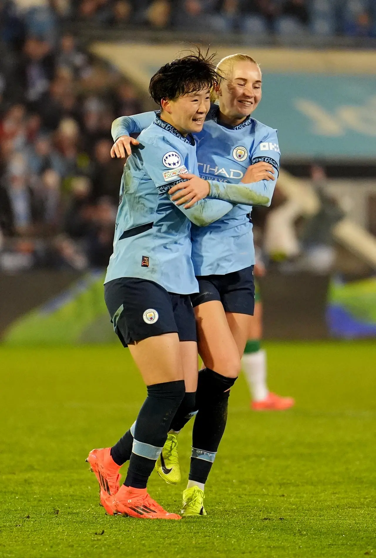 Aoba Fujino, left, celebrates with fellow goalscorer Laura Blindkilde Brown after scoring Manchester City’s second goal against Hammarby