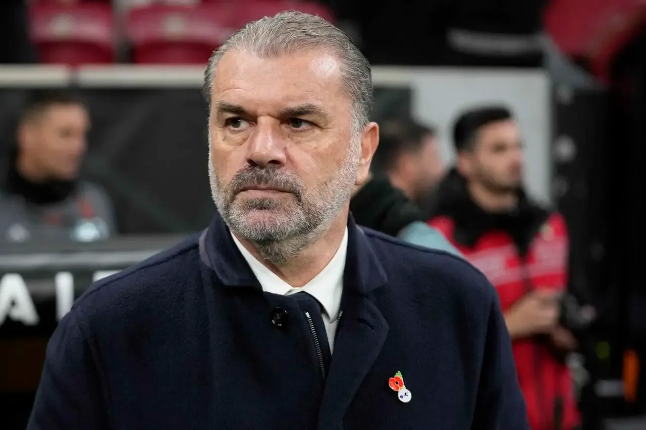 Tottenham head coach Ange Postecoglou watches on