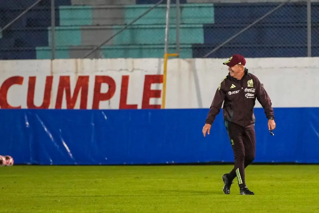 Mexico head coach Javier Aguirre walks on the pitch during a training session