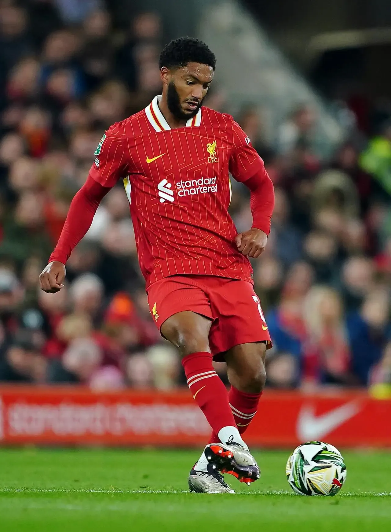 Liverpool’s Joe Gomez passes the ball