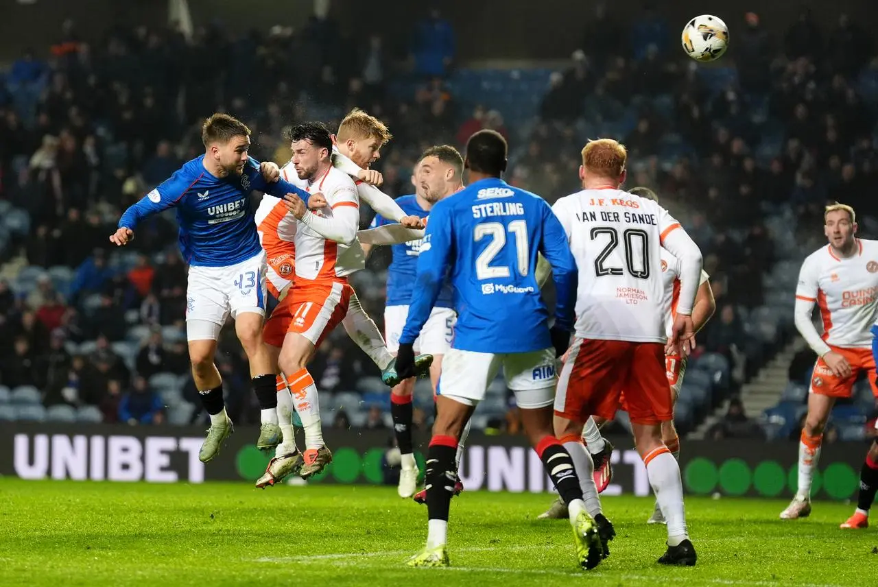 Match action shot with players battling to win a header