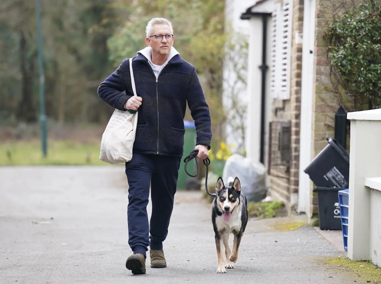 Match Of The Day host Gary Lineker returns to his home in London with his dog