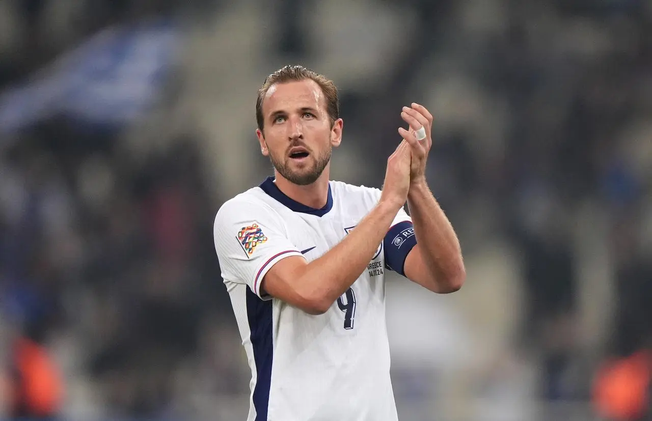 Harry Kane applauds the fans