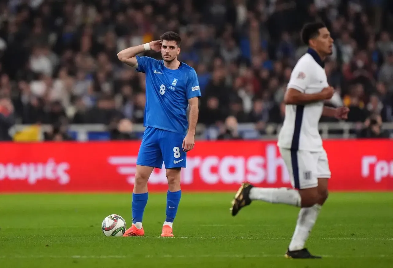 Greece’s Fotis Ioannidis appears dejected after England’s Jude Bellingham (right) scores