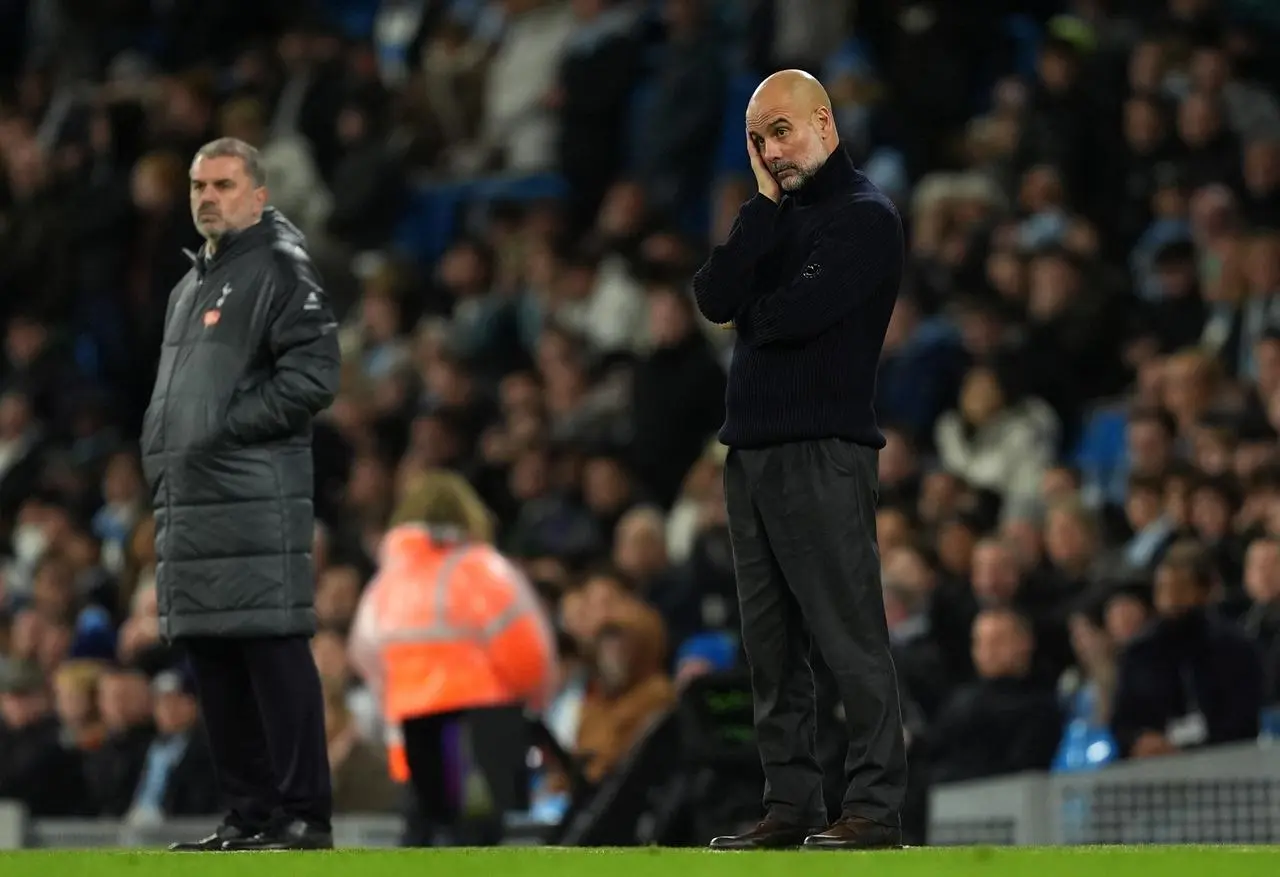 Pep Guardiola, right, appears frustrated during Manchester City's defeat to Tottenham