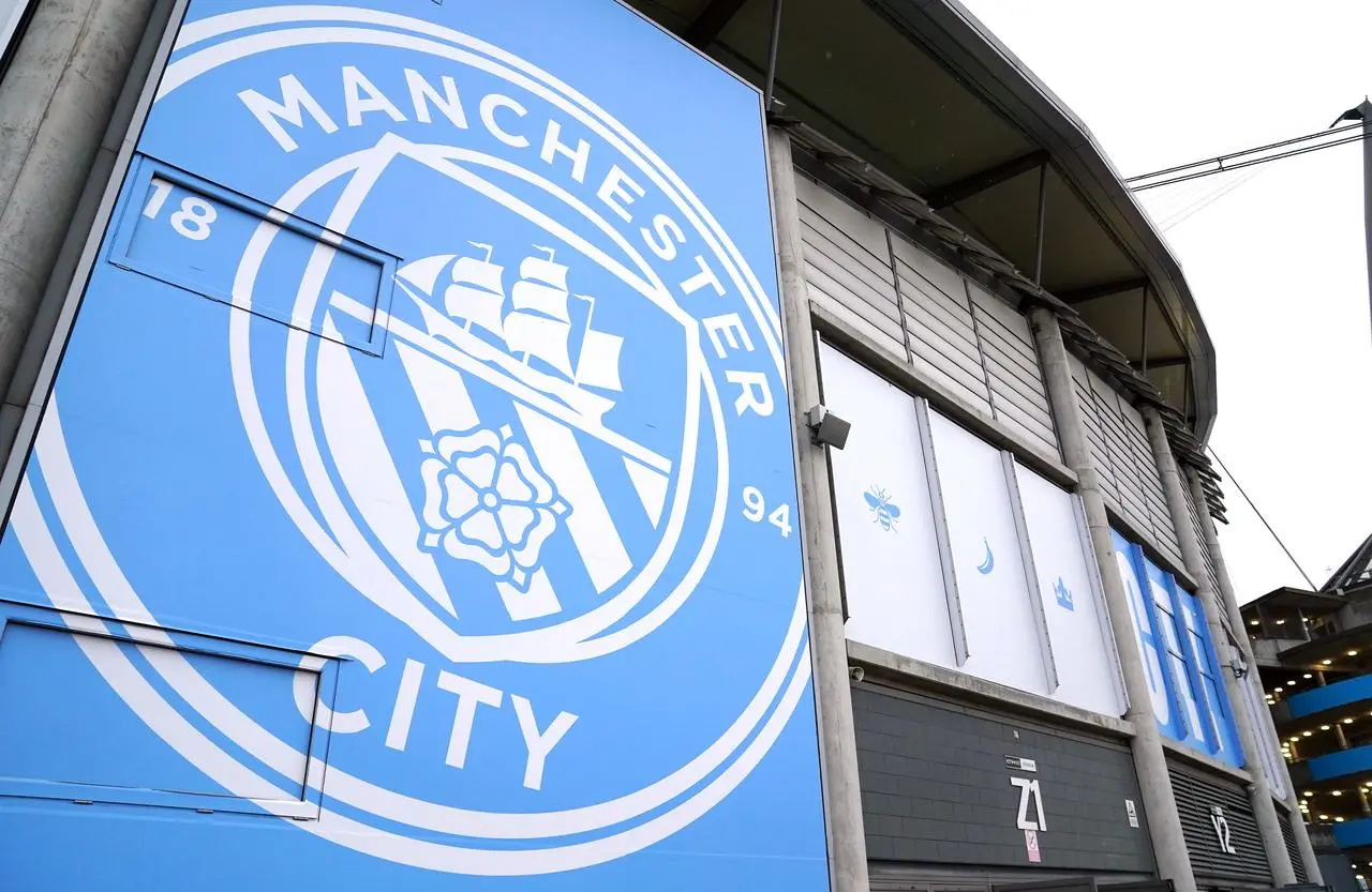 Manchester City's badge on the outside of the stadium