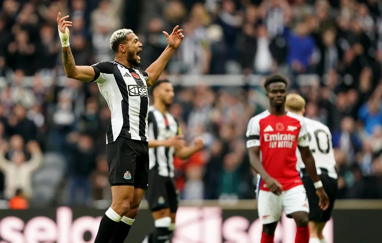 Newcastle players celebrate their victory against Arsenal