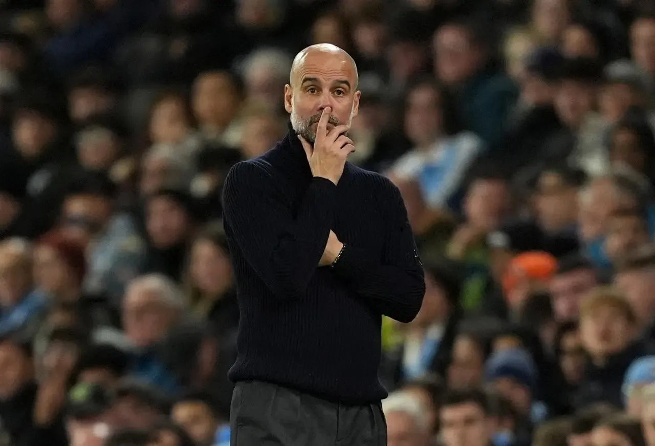 Manchester City manager Pep Guardiola, wearing black, puts his finger on his lips while on the touchline