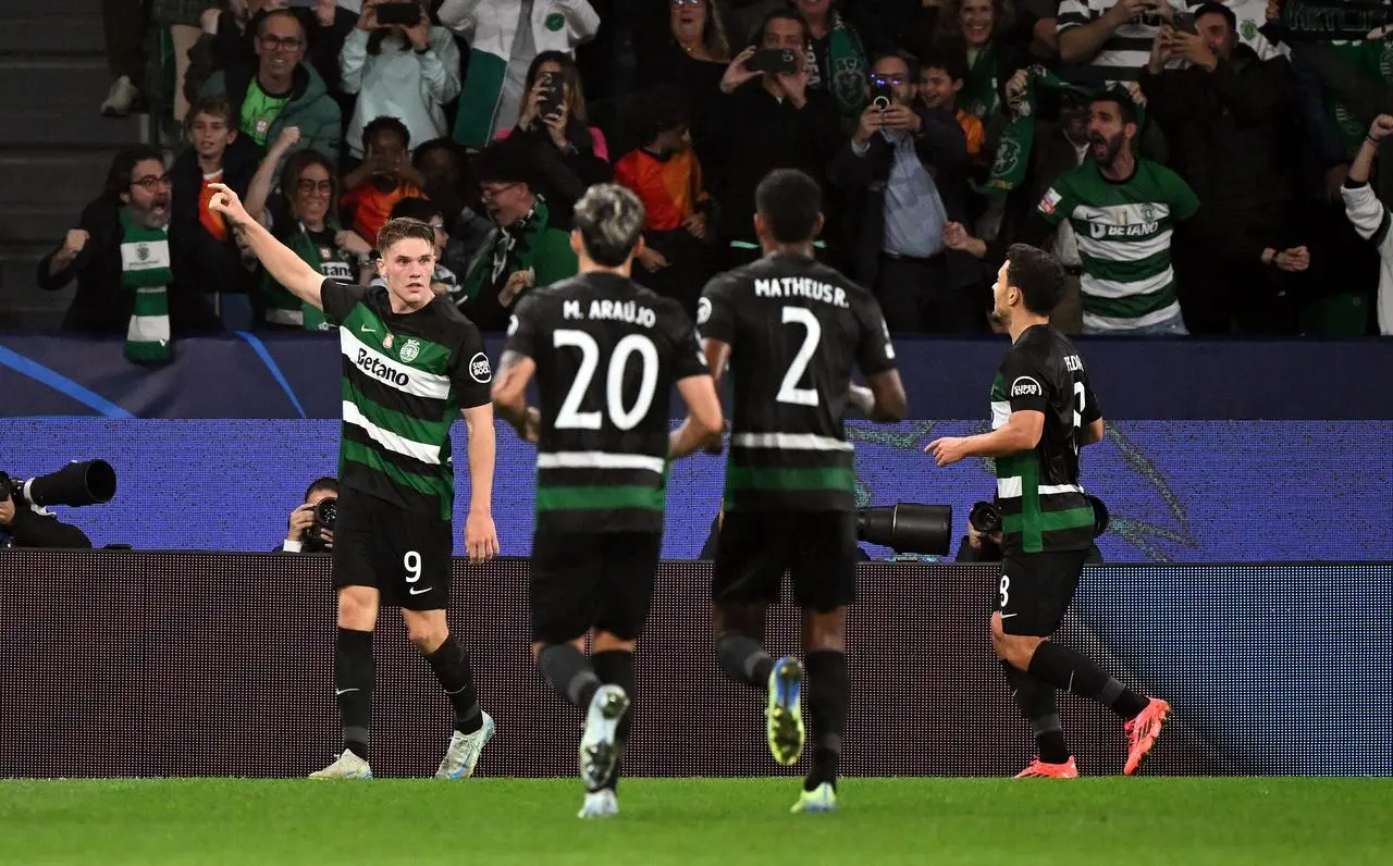 Sporting Lisbon’s Viktor Gyokeres, left, celebrates his first goal against Manchester City with team-mates