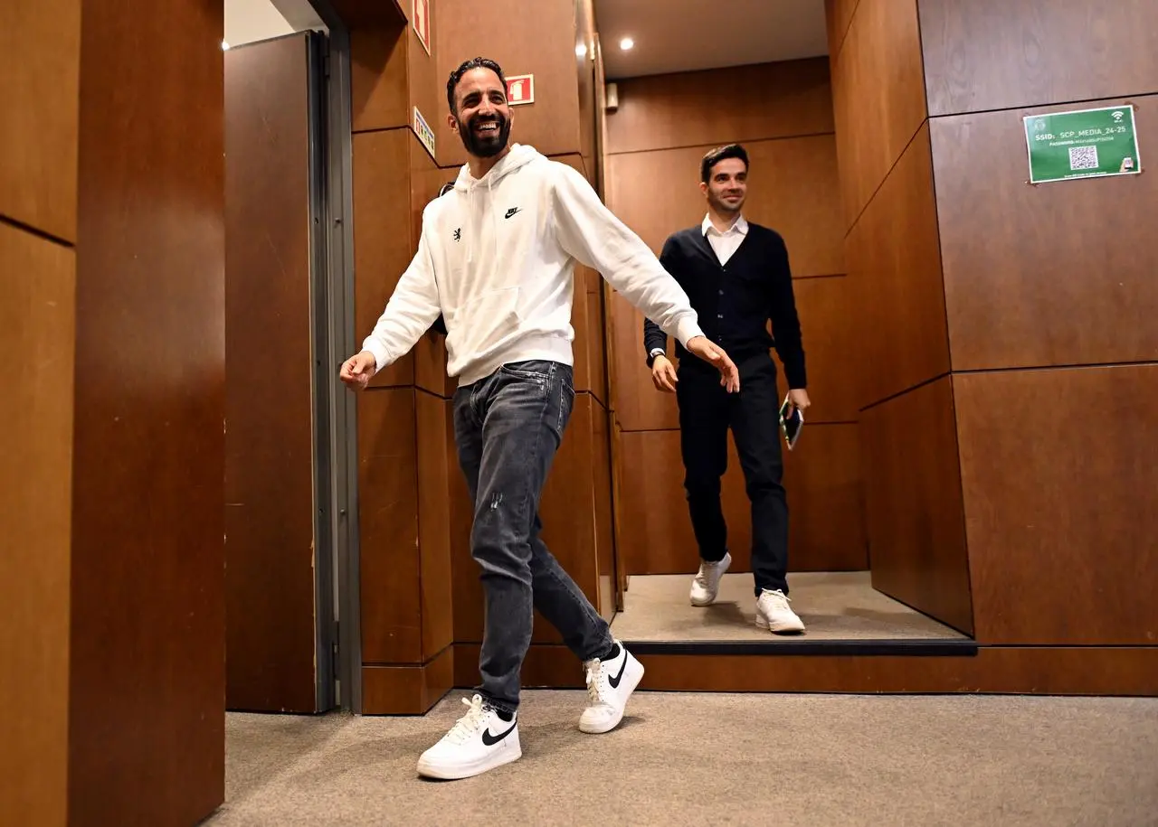 Sporting Lisbon manager Ruben Amorim leaves his press conference.