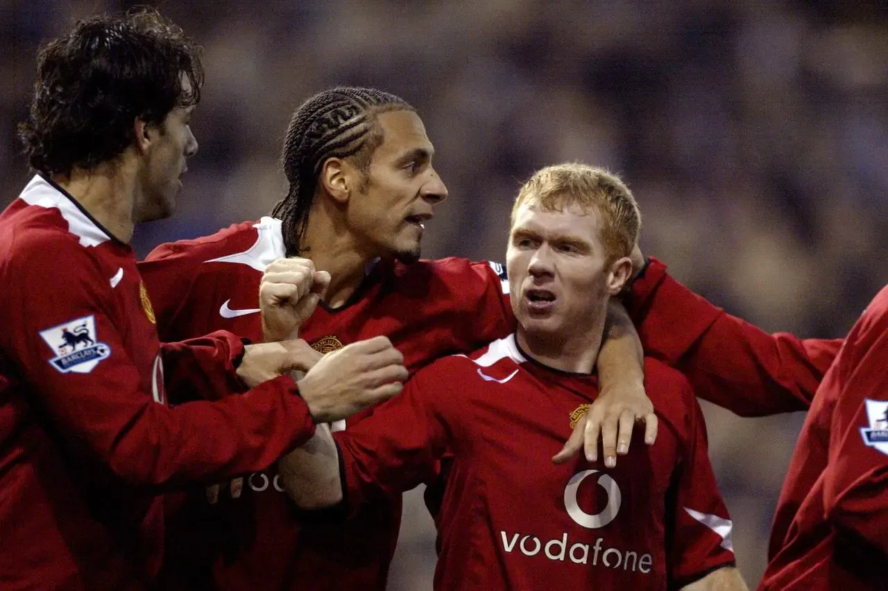 Paul Scholes, Rio Ferdinand and Ruud van Nistelrooy celebrate a goal for Manchester United