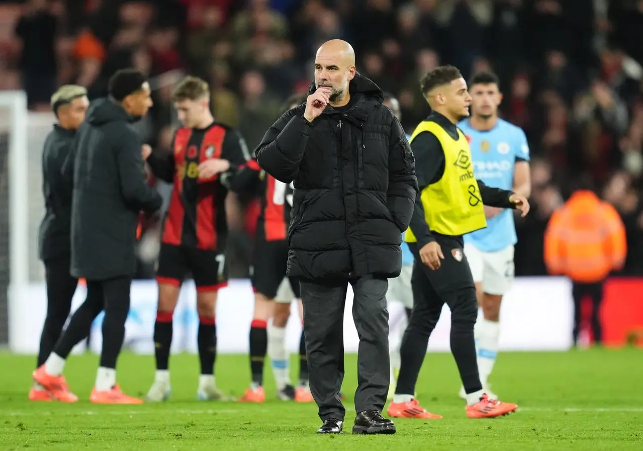 Pep Guardiola on the pitch after Manchester City's defeat at Bournemouth