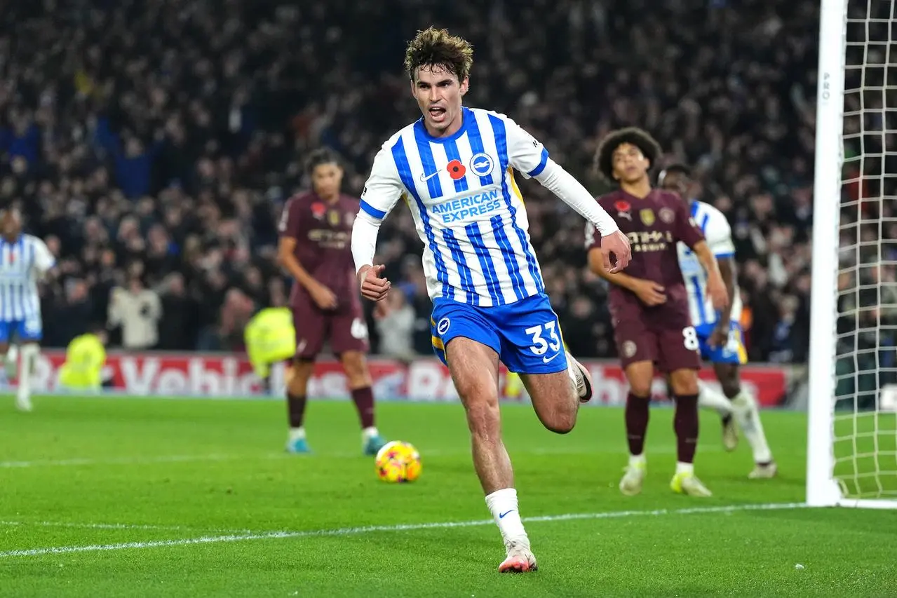 Matt O’Riley celebrates after scoring Brighton's winner as Manchester City players react in the background