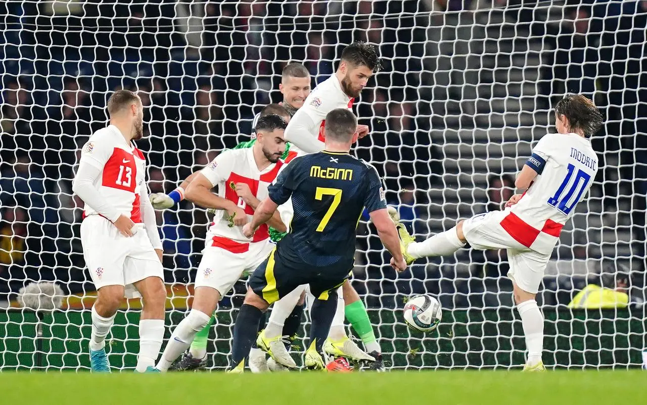 John McGinn, centre, scores Scotland’s winner against Croatia