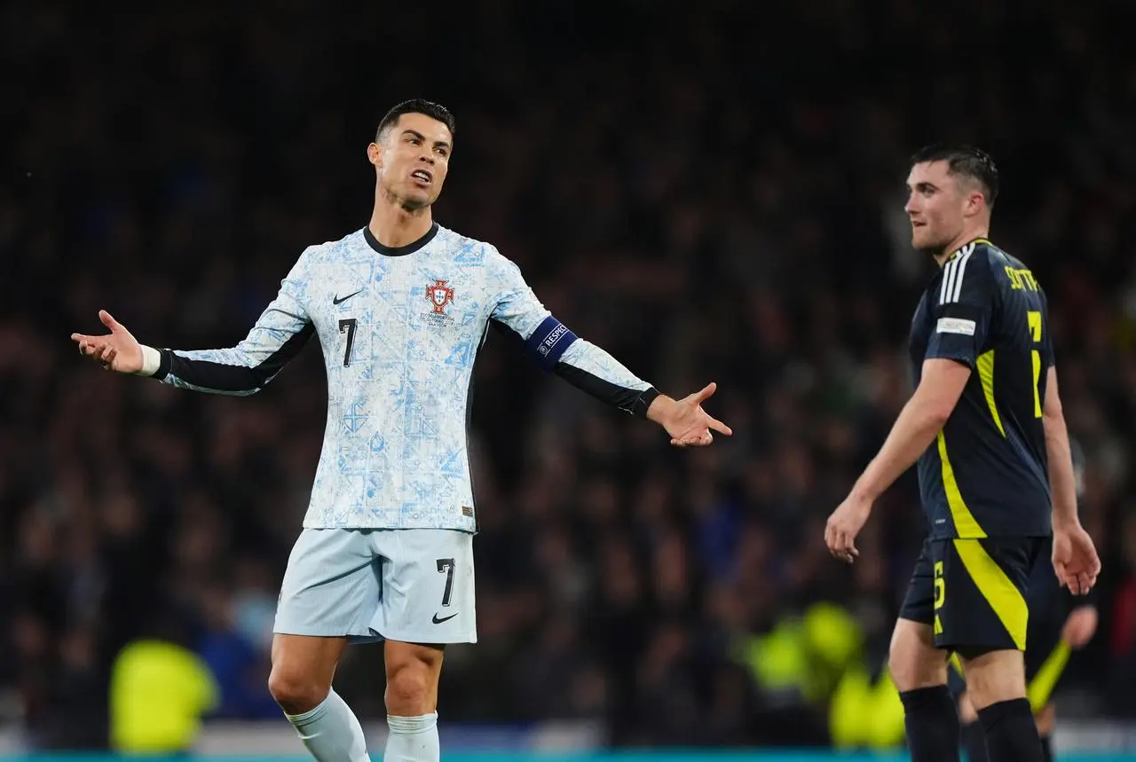 Cristiano Ronaldo remonstrates as John Souttar watches on