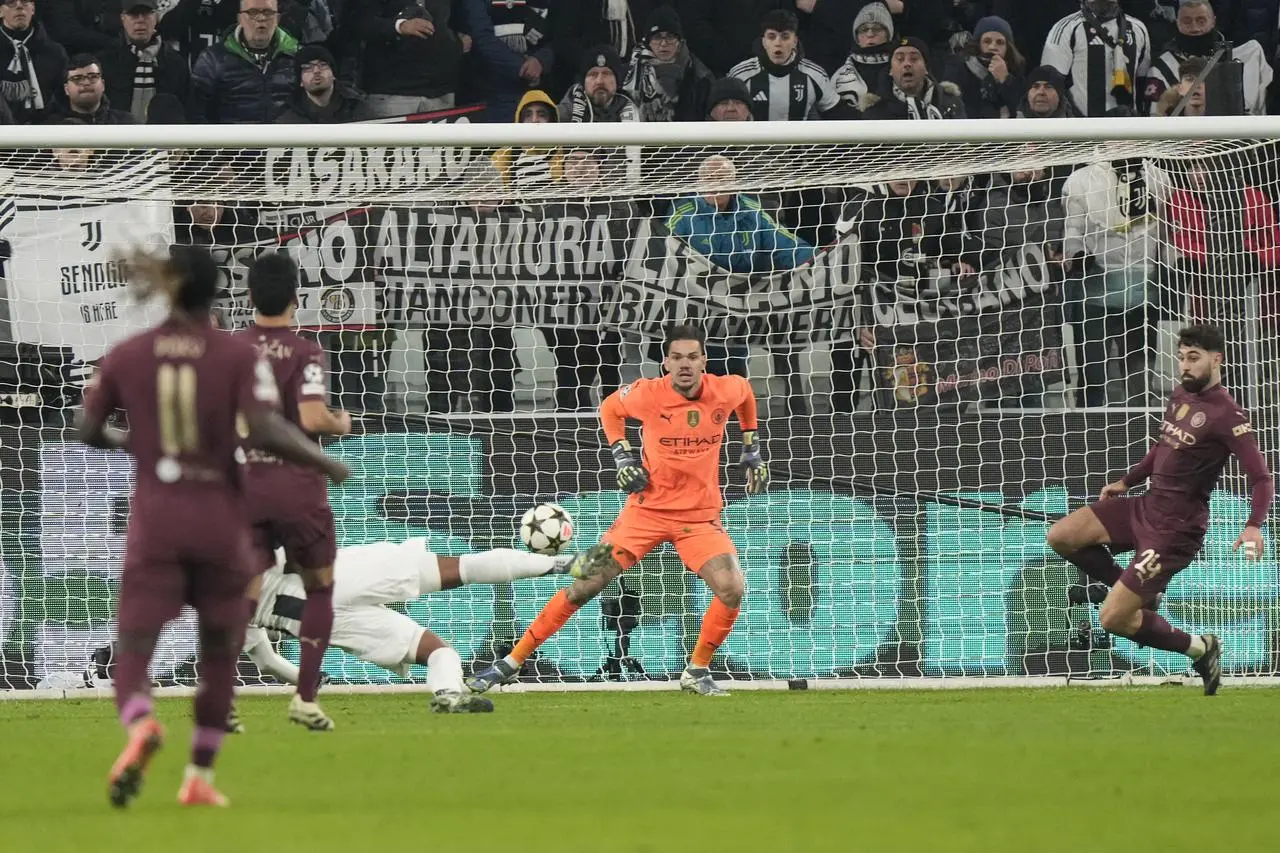 Juventus’ Weston McKennie, partly obscured, scores Juventus' second goal against Manchester City