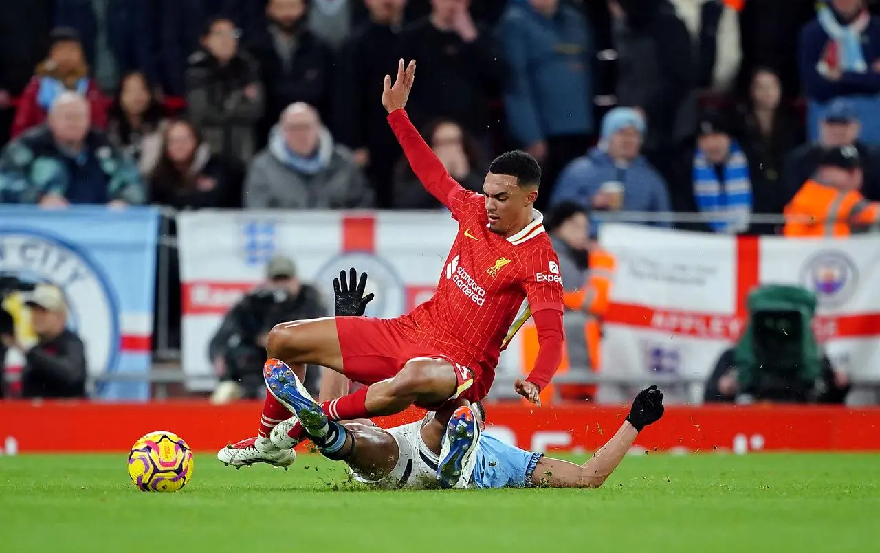 Manchester City’s Matheus Nunes fouls Liverpool’s Trent Alexander-Arnold