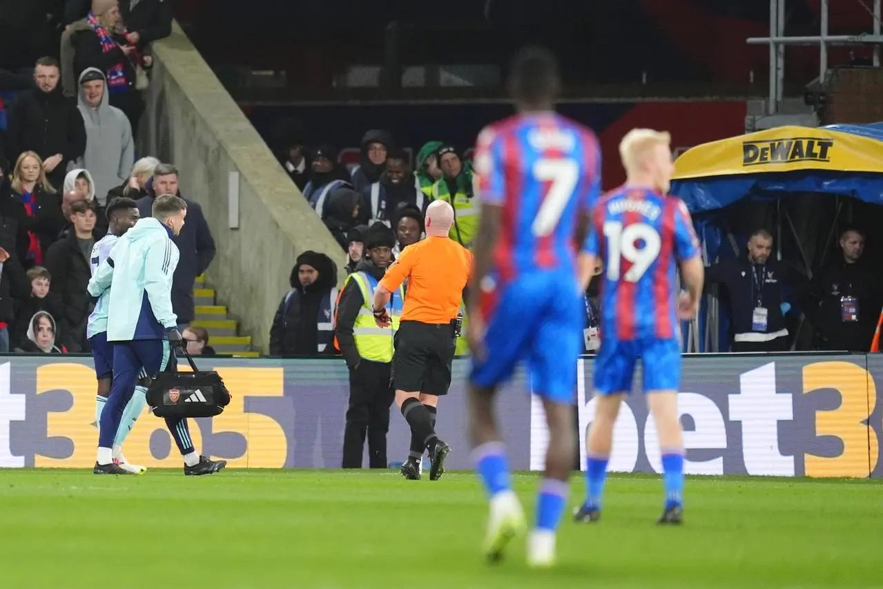 Bukayo Saka heads towards the tunnel after sustaining a hamstring injury