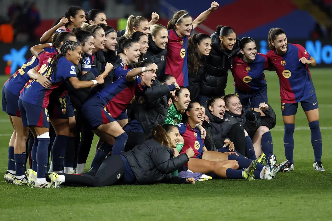 Barcelona players celebrate together after beating Manchester City in the Women's Champions League