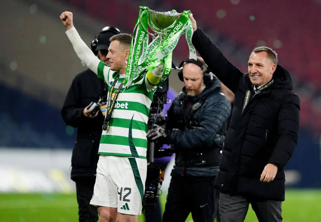 Brendan Rodgers, right, holds aloft the Premier Sports Cup trophy