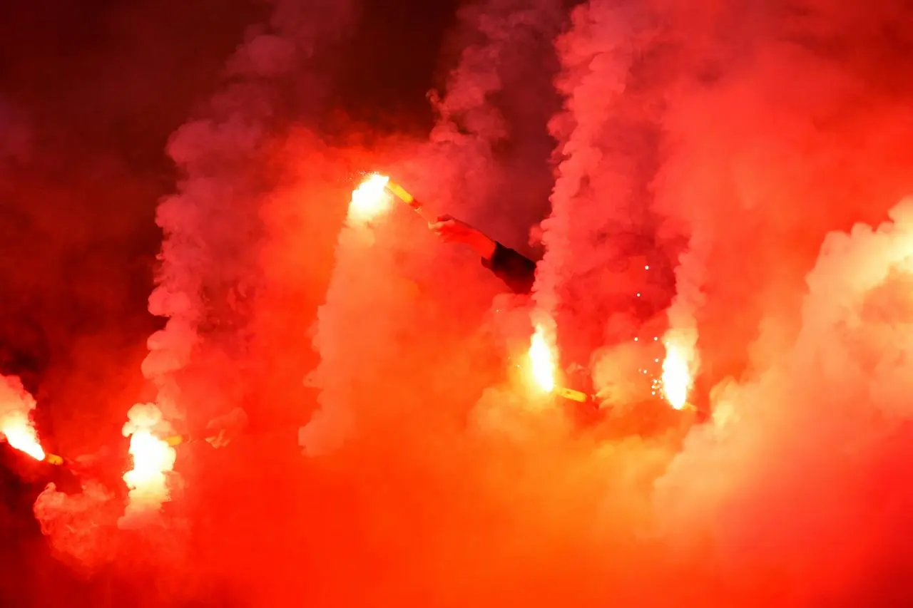 Motherwell fans with flares