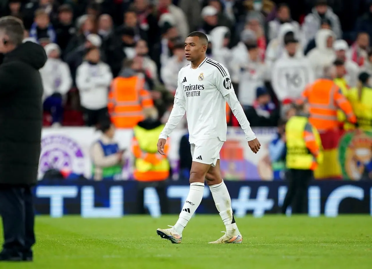 Real Madrid's Kylian Mbappe leaves the pitch at Anfield after his side's defeat by Liverpool