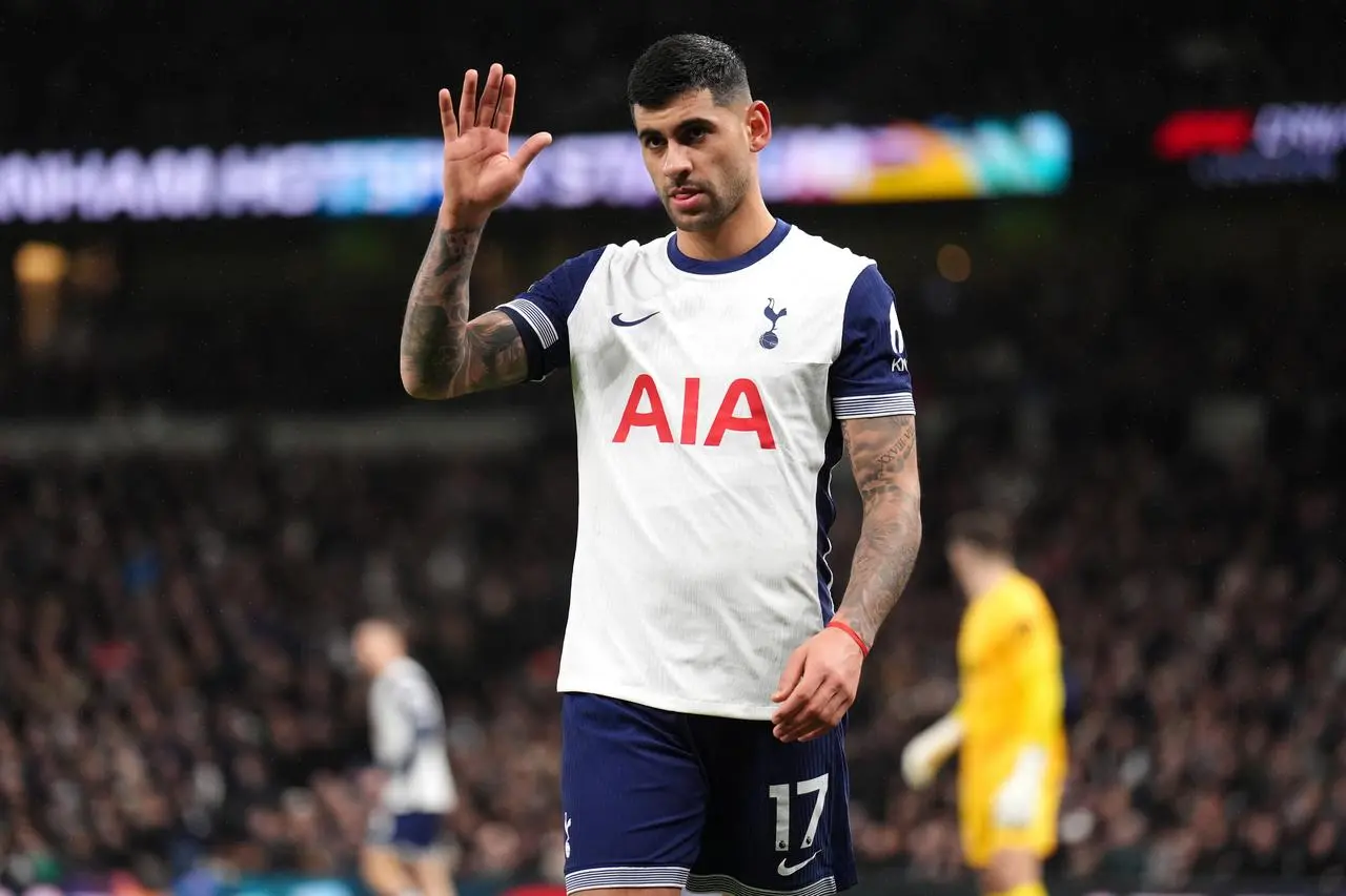 Tottenham defender Cristian Romero waves to the crowd