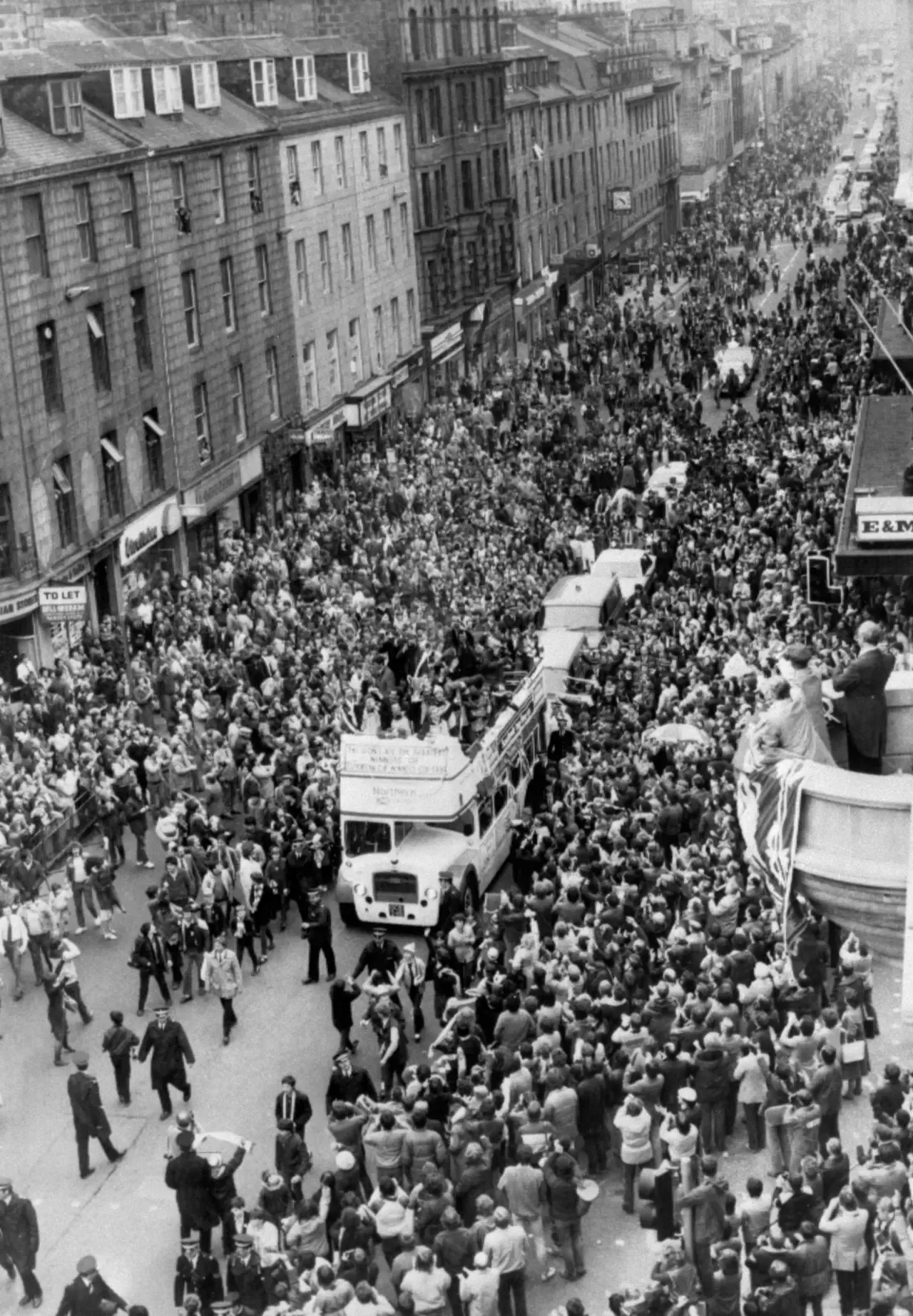 Aberdeen celebrate their European Cup Winners' Cup triumph in 1983 with an open-top bus parade through crowded streets