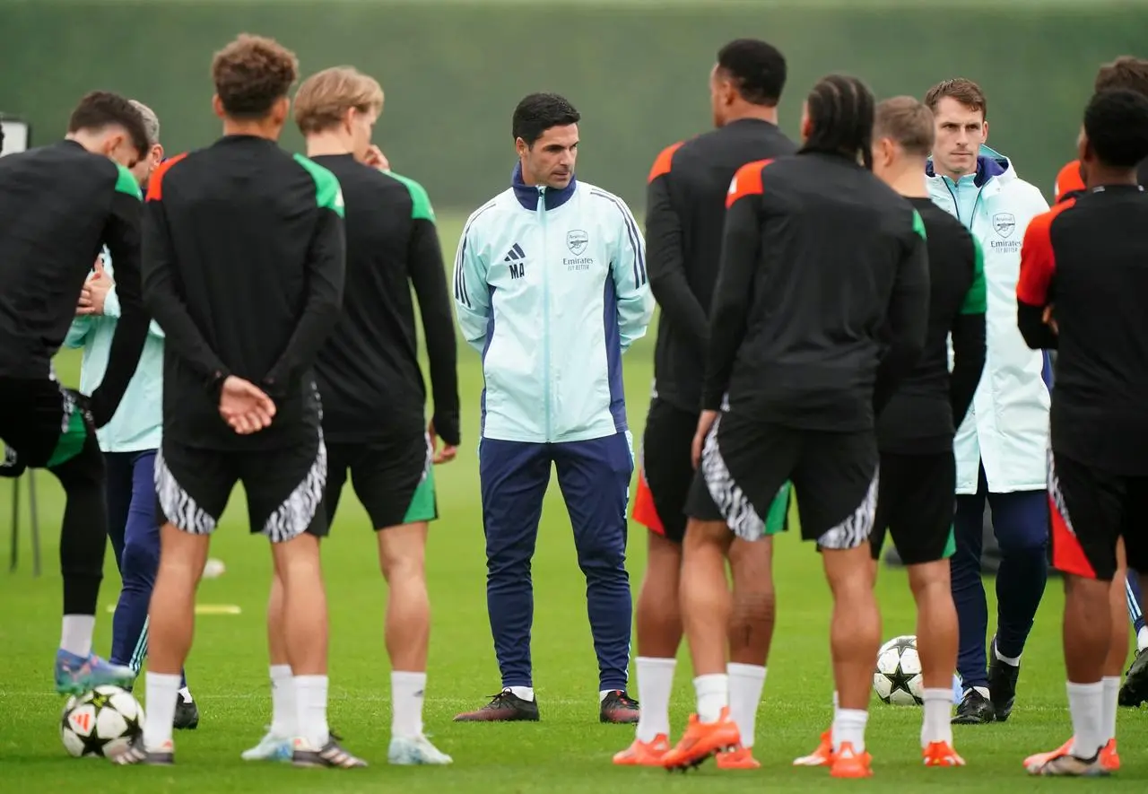 Mikel Arteta stands in the centre of his players during the training session at London Colney, St Albans