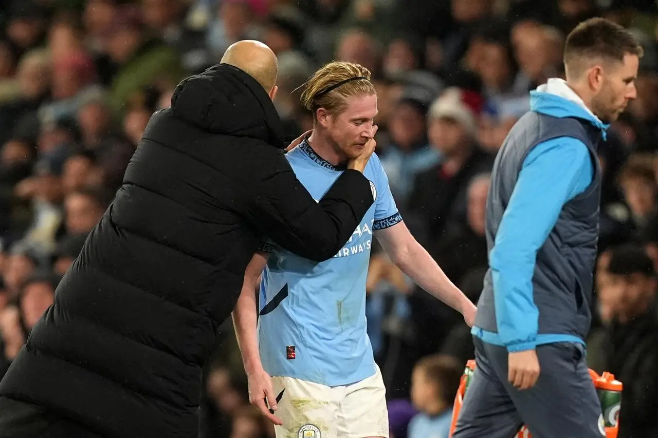 Pep Guardiola embraces Kevin De Bruyne on the touchline