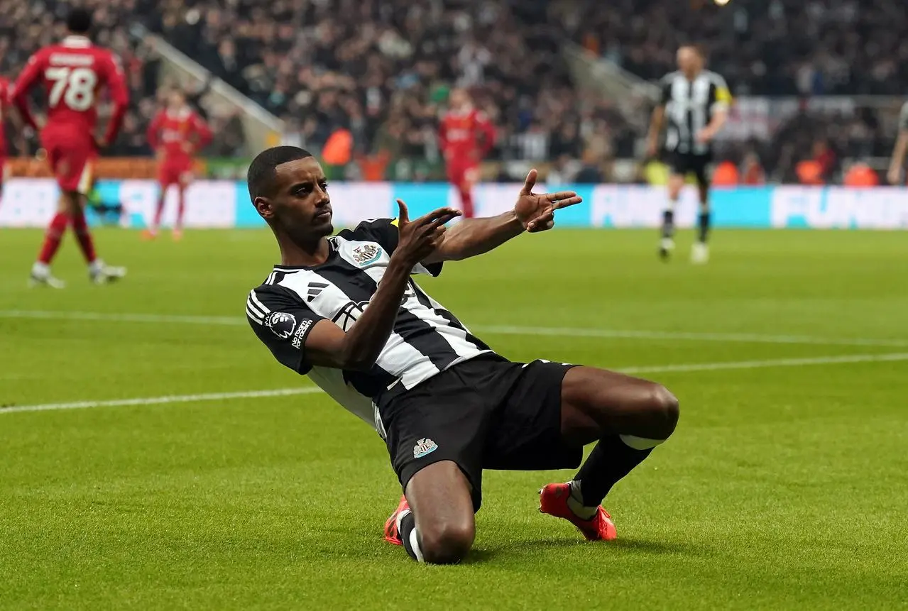 Newcastle's Alexander Isak celebrates after scoring the opening goal against Liverpool