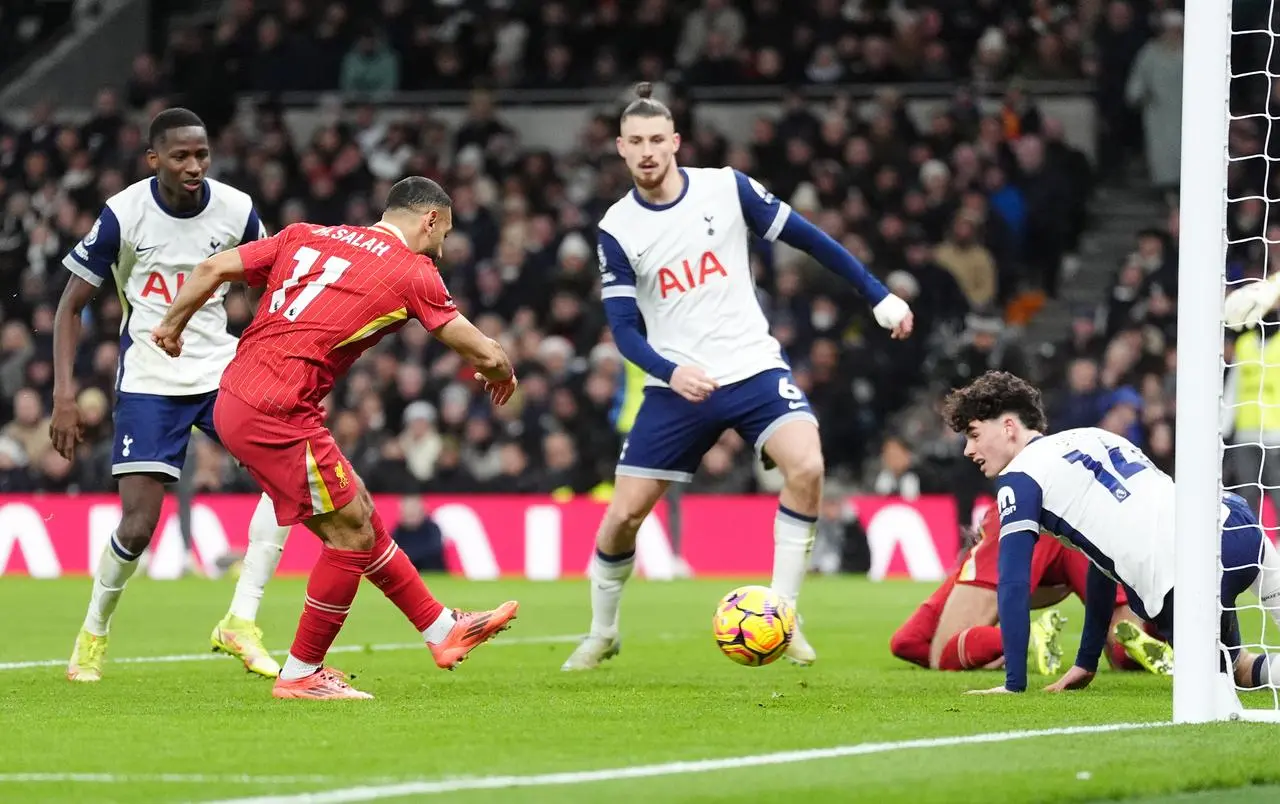 Liverpool’s Mohamed Salah (left) scores their fourth goal of the game