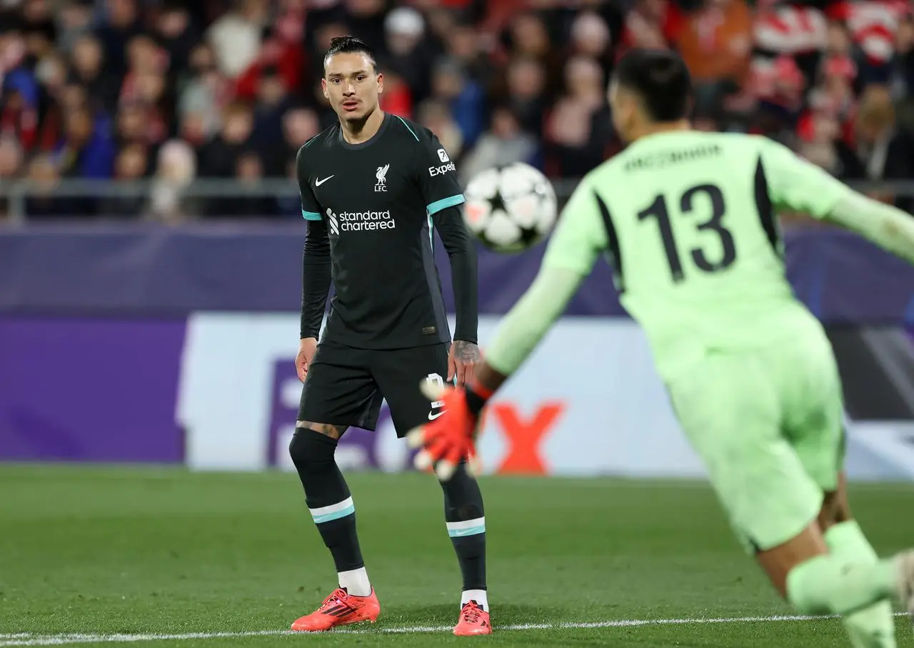 Liverpool striker Darwin Nunez watches Girona goalkeeper Paulo Gazzaniga clear the ball