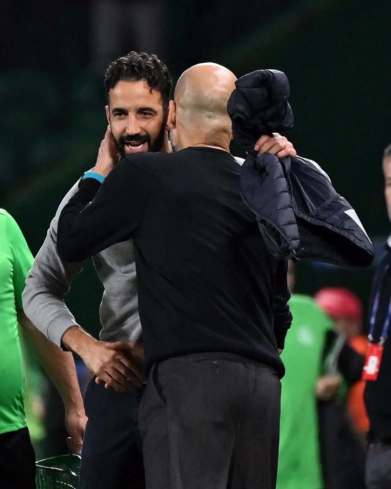 Pep Guardiola, right, embraces Ruben Amorim