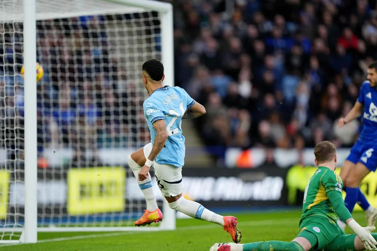 Manchester City’s Savinho has got past Leicester goalkeeper Jakub Stolarczyk and hits the ball into the top of the net to score