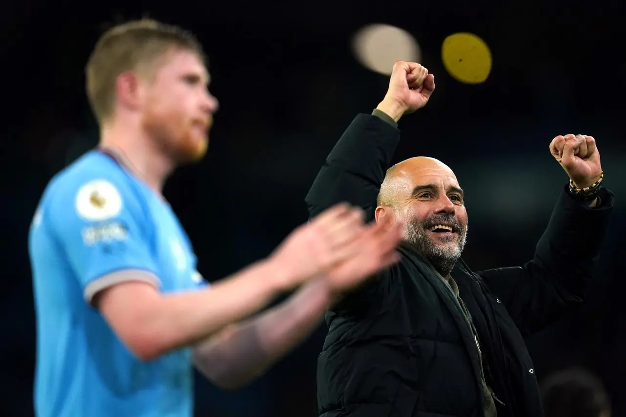 Kevon De Bruyne and Pep Guardiola celebrate a victory together